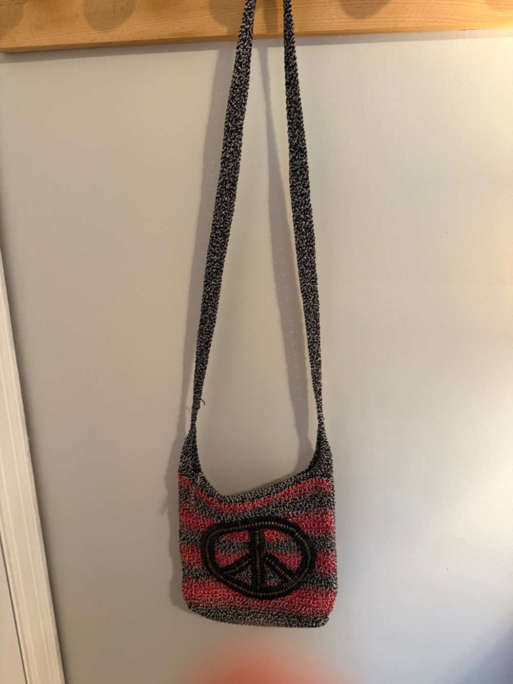 The Sak Crochet Peace Sign Crossbody Bag - Pink & Black